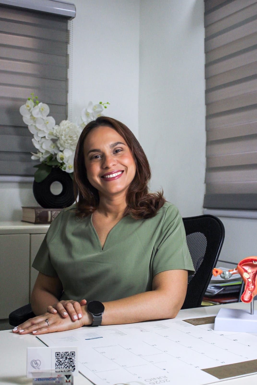 Dr. Nicolle Martínez smiling in her office in Gazcue